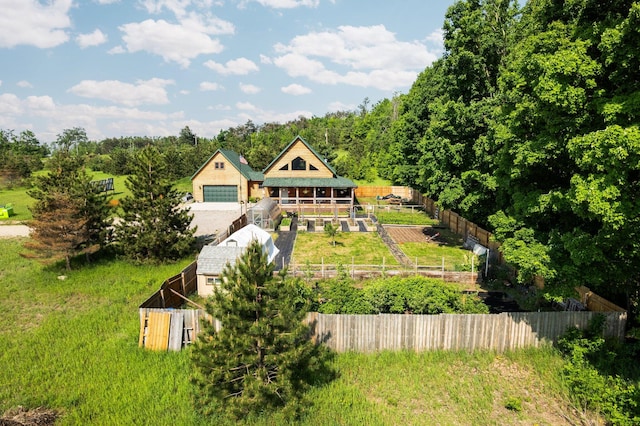 8406 S Shire Rd, Vanderbilt, MI 49795 - view of front facade with a detached garage