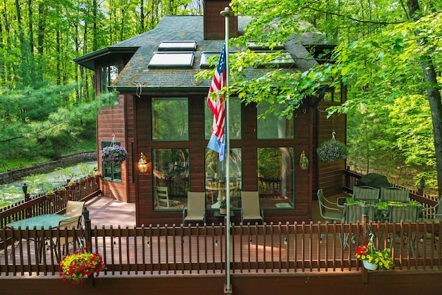 211 Gardners Grv, Roscommon, MI 48653 - view of front facade with a chimney