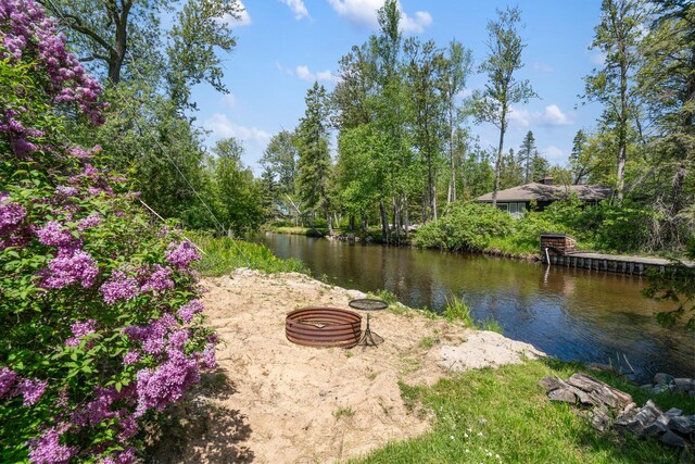 3869 Club Rd, Indian River, MI 49749 - view of yard featuring a fire pit and a water view