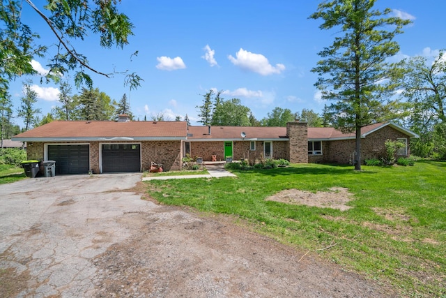 3869 Club Rd, Indian River, MI 49749 - single story home featuring driveway, a chimney, a front yard, a garage, and brick siding