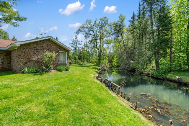 3869 Club Rd, Indian River, MI 49749 - view of green lawn featuring a water view
