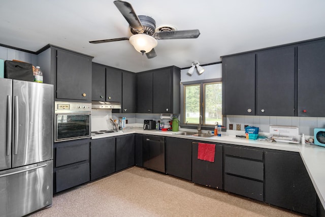 3869 Club Rd, Indian River, MI 49749 - kitchen with freestanding refrigerator, a sink, under cabinet range hood, dishwashing machine, and oven
