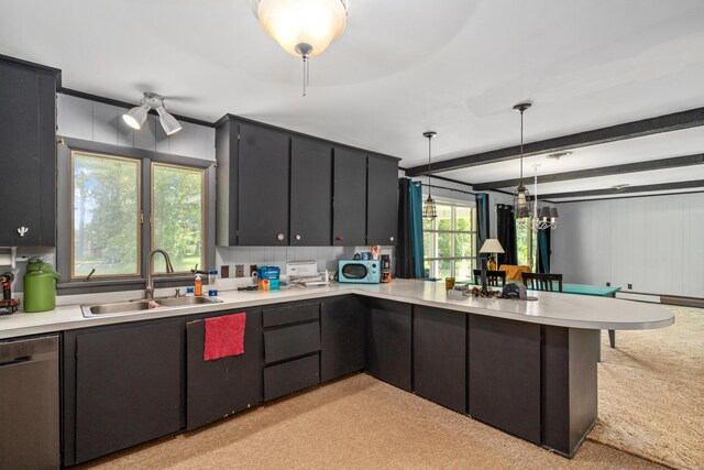 3869 Club Rd, Indian River, MI 49749 - kitchen with a sink, dishwasher, light countertops, a peninsula, and light carpet