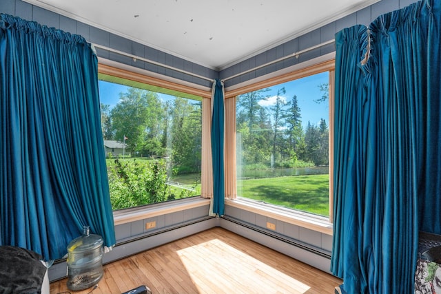 3869 Club Rd, Indian River, MI 49749 - detailed view of wood finished floors, ornamental molding, and a tree filled landscape