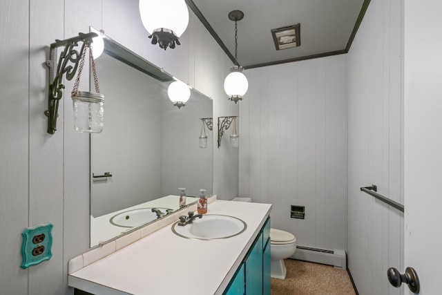 3869 Club Rd, Indian River, MI 49749 - half bath with a baseboard heating unit, toilet, and vanity