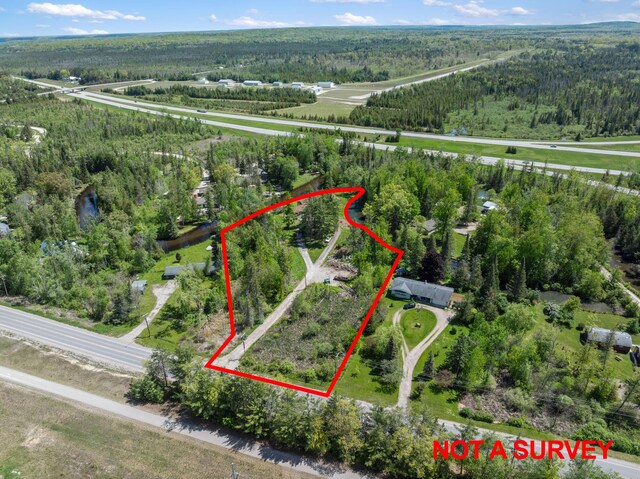 3869 Club Rd, Indian River, MI 49749 - aerial view of property and surrounding area featuring a forest and property boundaries highlighted