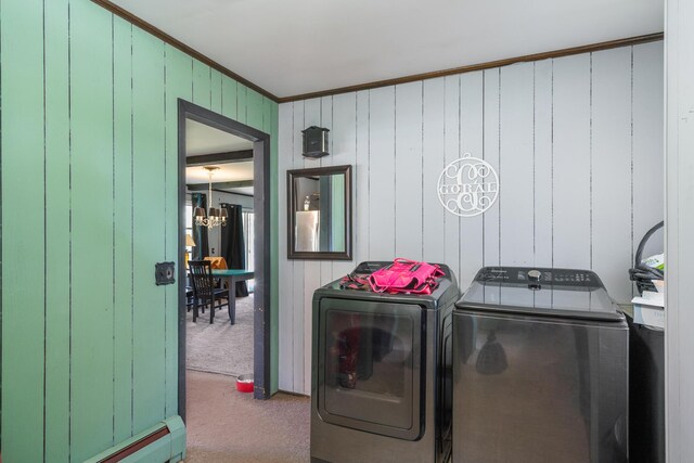 3869 Club Rd, Indian River, MI 49749 - laundry room with separate washer and dryer, carpet floors, crown molding, a chandelier, and a baseboard radiator