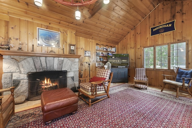 215 Pine Bluffs Rd, Roscommon, MI 48653 - living area with lofted ceiling, wooden walls, a fireplace, and wood ceiling