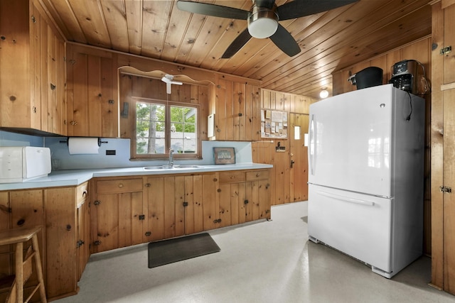 215 Pine Bluffs Rd, Roscommon, MI 48653 - kitchen featuring freestanding refrigerator, wood ceiling, a sink, light countertops, and a ceiling fan