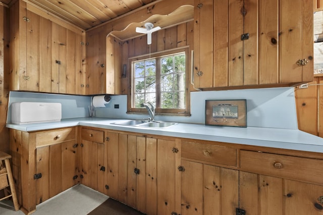 215 Pine Bluffs Rd, Roscommon, MI 48653 - kitchen featuring a sink, light countertops, wood ceiling, and brown cabinets