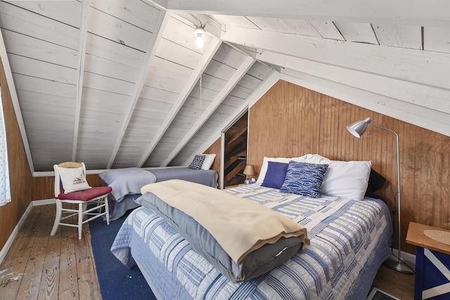 215 Pine Bluffs Rd, Roscommon, MI 48653 - bedroom featuring wooden walls, wood-type flooring, and wood ceiling