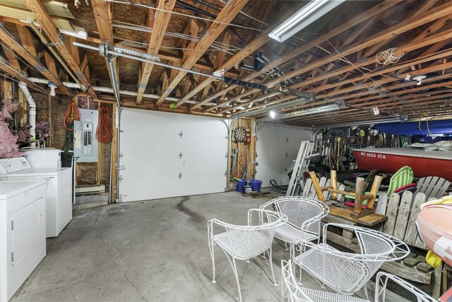 215 Pine Bluffs Rd, Roscommon, MI 48653 - garage featuring electric panel and separate washer and dryer