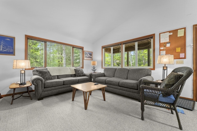 215 Pine Bluffs Rd, Roscommon, MI 48653 - carpeted living room with plenty of natural light, high vaulted ceiling, and baseboards