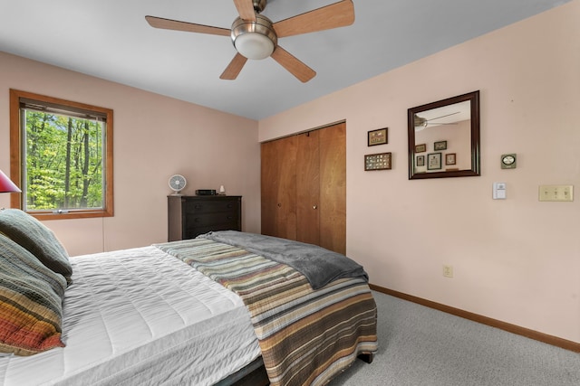 215 Pine Bluffs Rd, Roscommon, MI 48653 - bedroom with carpet, baseboards, a closet, and ceiling fan