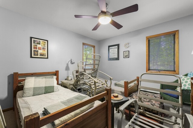 215 Pine Bluffs Rd, Roscommon, MI 48653 - bedroom with a ceiling fan and baseboards