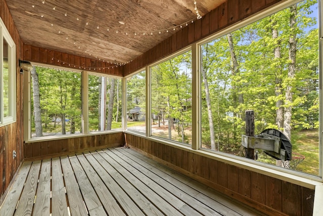215 Pine Bluffs Rd, Roscommon, MI 48653 - unfurnished sunroom featuring view of wooded area