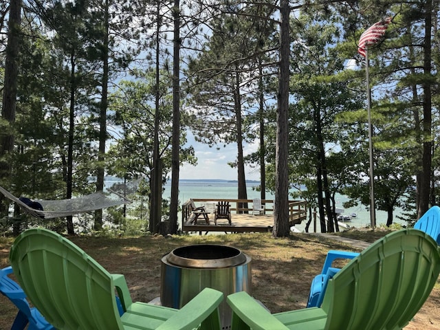 215 Pine Bluffs Rd, Roscommon, MI 48653 - view of yard featuring a deck with water view