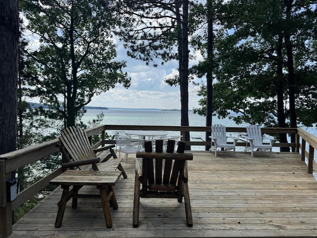 215 Pine Bluffs Rd, Roscommon, MI 48653 - wooden terrace with a water view
