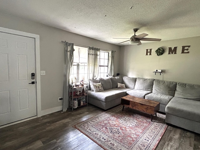 1200 Crestview Dr, Alpena, MI 49707 - living room featuring a textured ceiling, ceiling fan, wood finished floors, and baseboards