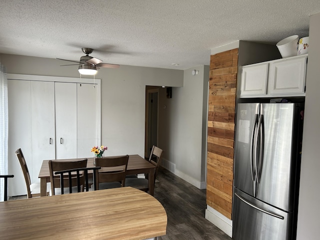 1200 Crestview Dr, Alpena, MI 49707 - dining space with a ceiling fan, dark wood-style floors, a textured ceiling, and baseboards