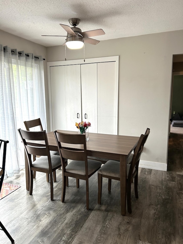 1200 Crestview Dr, Alpena, MI 49707 - dining room featuring ceiling fan, wood finished floors, a textured ceiling, and baseboards