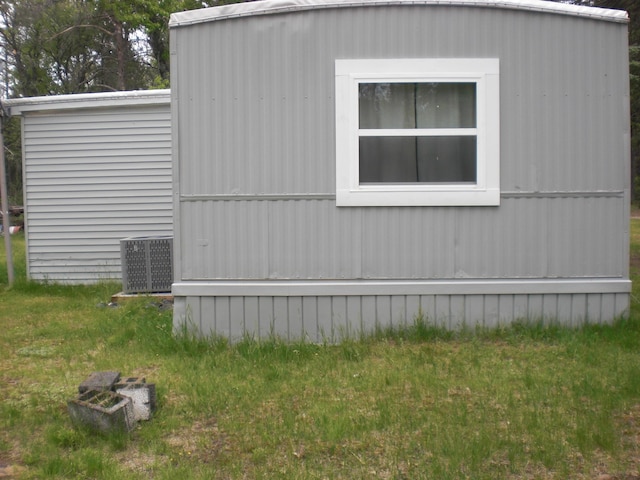 3123 Lovells Rd, Grayling, MI 49738 - view of side of home with central AC