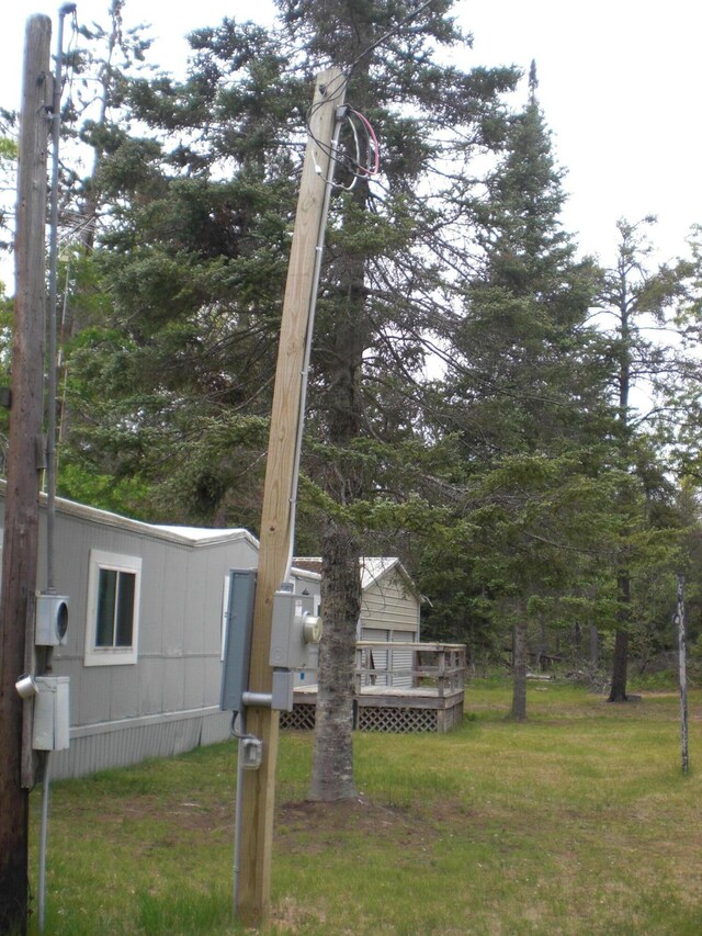 3123 Lovells Rd, Grayling, MI 49738 - view of grassy yard with a deck