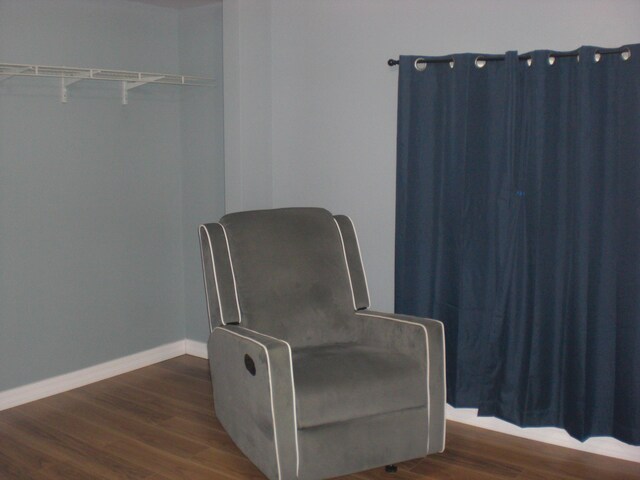 3123 Lovells Rd, Grayling, MI 49738 - living area featuring dark wood finished floors and baseboards