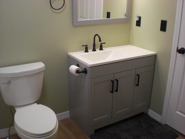 3123 Lovells Rd, Grayling, MI 49738 - half bath with vanity, toilet, and baseboards