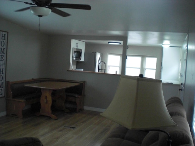 3123 Lovells Rd, Grayling, MI 49738 - dining area featuring baseboards, a ceiling fan, and wood finished floors