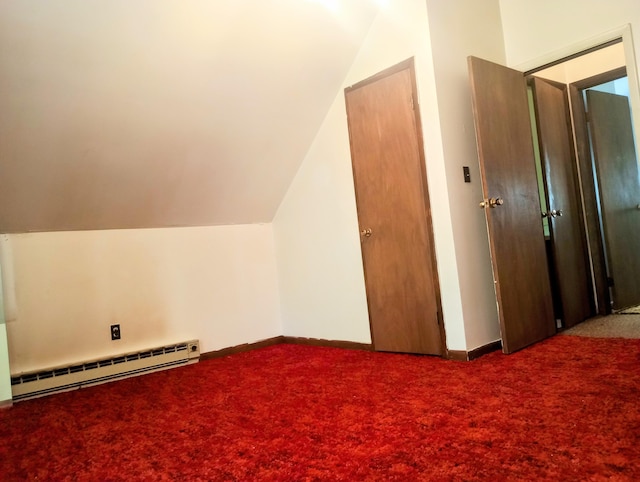 206 Redwine Dr, Houghton Lake, MI 48629 - additional living space featuring baseboard heating, carpet floors, lofted ceiling, and baseboards