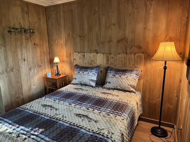7386 Cheboygan St, Alanson, MI 49706 - bedroom with wood walls and wood finished floors