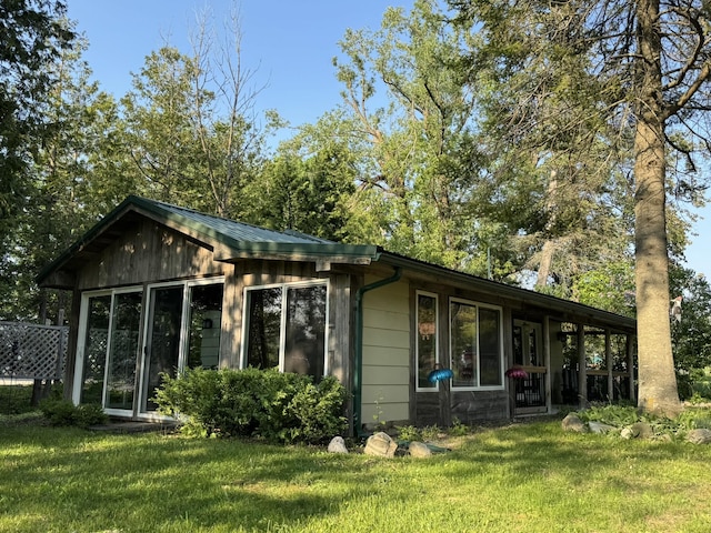7386 Cheboygan St, Alanson, MI 49706 - view of front of house with a front yard