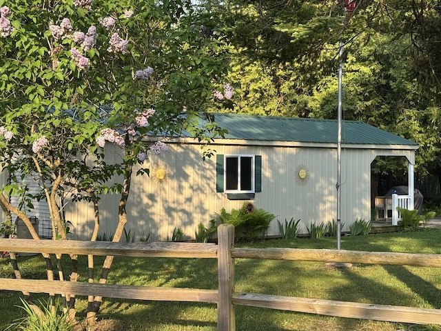 7386 Cheboygan St, Alanson, MI 49706 - view of side of property with a metal roof