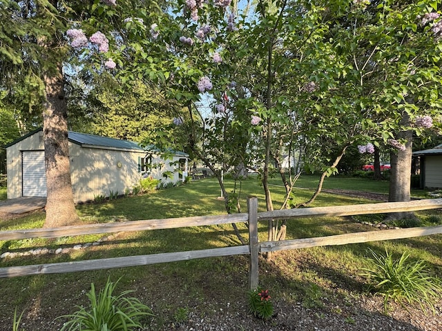 7386 Cheboygan St, Alanson, MI 49706 - view of yard with an outbuilding and a detached garage