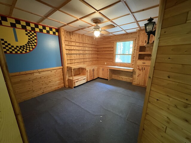 20730 E Riverside Dr, Hillman, MI 49746 - spare room featuring wooden walls and ceiling fan