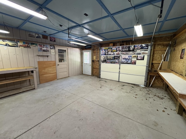 20730 E Riverside Dr, Hillman, MI 49746 - garage featuring a workshop area