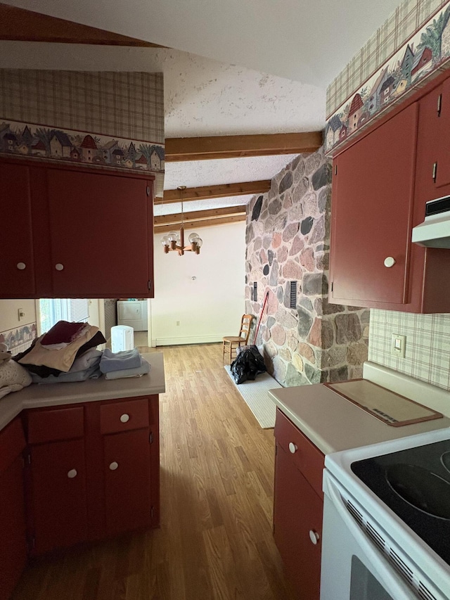 20730 E Riverside Dr, Hillman, MI 49746 - kitchen with under cabinet range hood, wood finished floors, light countertops, beamed ceiling, and white electric range oven
