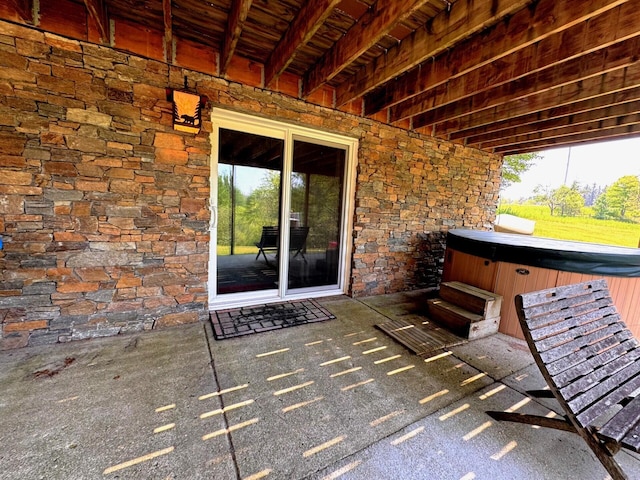 6309 Hiawatha Dr, Frederic, MI 49733 - view of patio / terrace with a hot tub