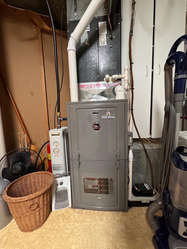6309 Hiawatha Dr, Frederic, MI 49733 - utility room featuring heating unit