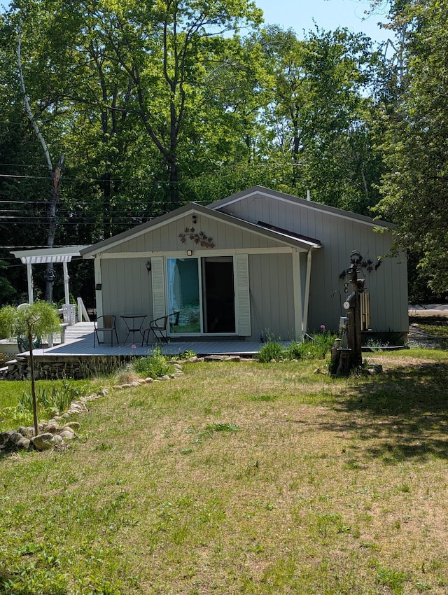 17740 Grand Lake Blvd, Presque Isle, MI 49777 - view of front facade featuring a front yard, a deck, and a pergola