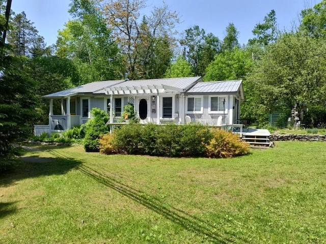 17740 Grand Lake Blvd, Presque Isle, MI 49777 - view of front facade featuring a pergola, a front yard, metal roof, and a standing seam roof