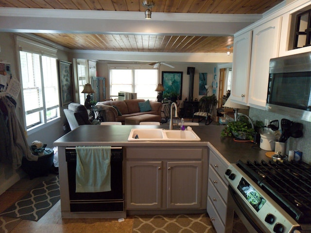 17740 Grand Lake Blvd, Presque Isle, MI 49777 - kitchen with stainless steel range with gas stovetop, dishwasher, wood ceiling with exposed beams, a peninsula, and a sink
