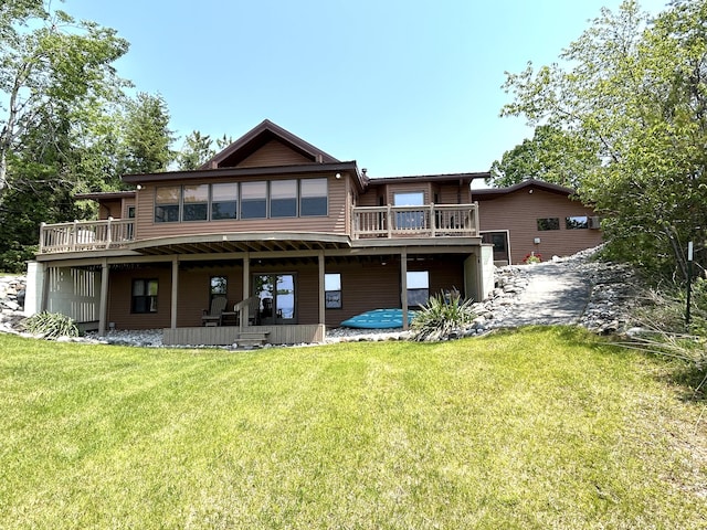 5392 Silver Beach Rd, Onaway, MI 49765 - back of property featuring a deck and a yard