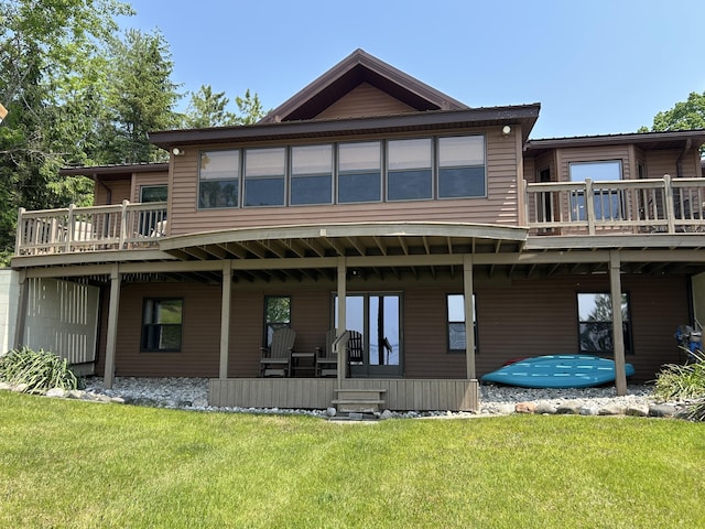 5392 Silver Beach Rd, Onaway, MI 49765 - rear view of house featuring a yard and a wooden deck