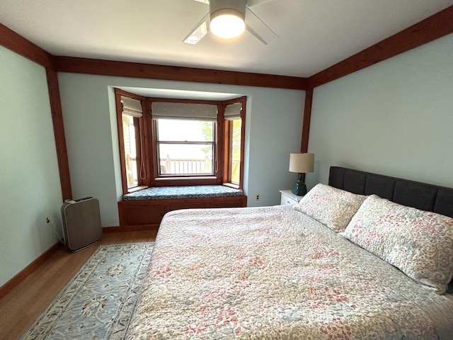 5392 Silver Beach Rd, Onaway, MI 49765 - bedroom featuring light wood-style flooring and a ceiling fan