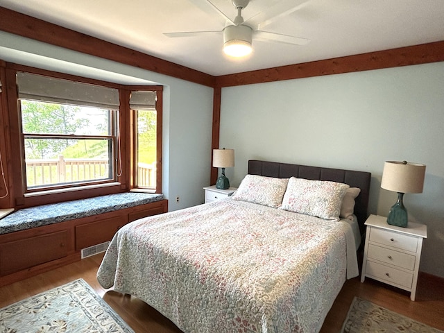 5392 Silver Beach Rd, Onaway, MI 49765 - bedroom featuring wood finished floors and a ceiling fan