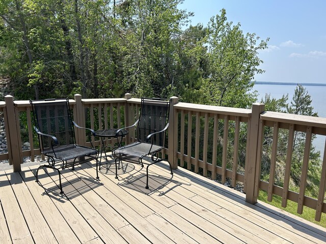 5392 Silver Beach Rd, Onaway, MI 49765 - wooden terrace featuring a water view