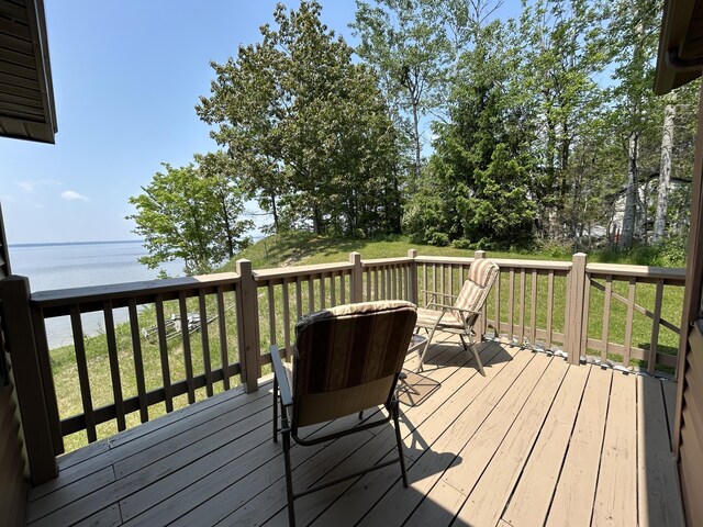 5392 Silver Beach Rd, Onaway, MI 49765 - wooden terrace with a water view