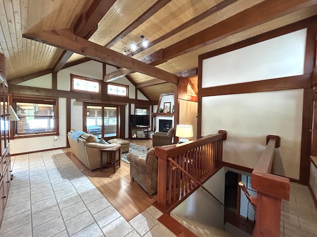 5392 Silver Beach Rd, Onaway, MI 49765 - living room featuring wood ceiling, a fireplace, and baseboards